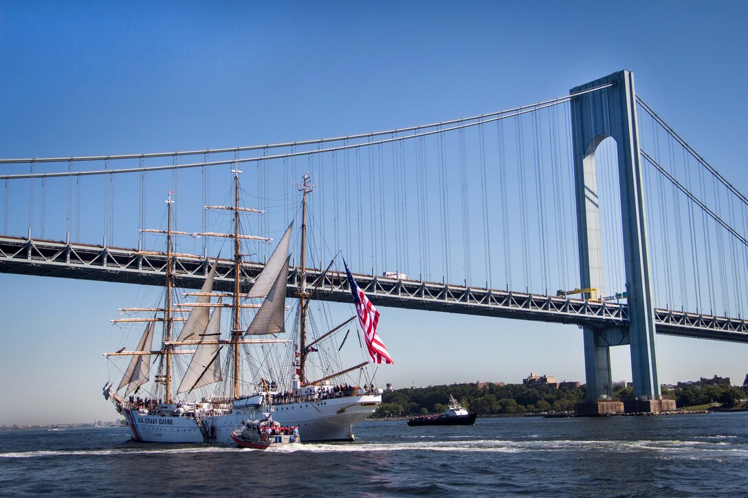 The U.S. Coast Guard Cutter Eagle sails under the Verrazano-Narrows Bridge as it enters New York City's inner harbor, July 31, 2015.