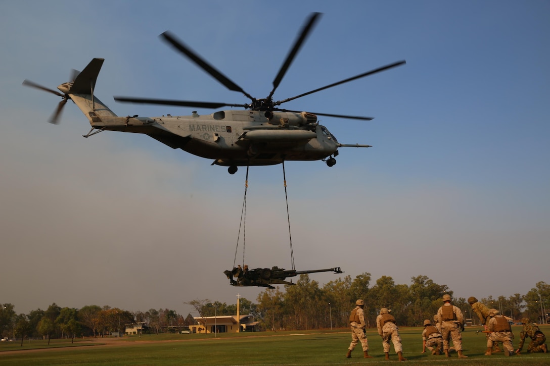 A U.S. Marine Corps CH-53E Super Stallion helicopter with Marine Heavy Helicopter Squadron 463, Marine Rotational Force – Darwin, conducts an external lift of an M777A2 lightweight 155 mm howitzer  Aug. 5, at Robertson Barracks, Palmerston, Northern Territory. The Marine pilots and aircrew, along with soldiers with 8th/ 12th Regiment, Royal Australian Artillery, 1st Brigade, Australian Army, Australian Defence Force, planned and conducted the external lift of the howitzer and familiarized both units with each other’s training procedures to enhance interoperability. The MRF-D six-month deployment demonstrates how the Marine Air-Ground Task Force is equipped and organized to carry out national objectives in cooperation with our international partners.