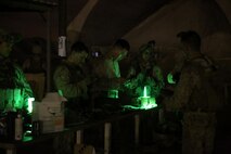 U.S. Marines with Headquarters Company, 3rd Battalion, 7th Marine Regiment, Special Purpose Marine Air-Ground Task Force-Crisis Response-Central Command, load magazines for a night shoot in Southwest Asia, Aug. 8, 2015. These Marines provide security at one of the SPMAGTF operating bases in the Middle East. The Marines and Sailors of SPMAGTF-CR-CC offer rapid, task-organized solutions to the commander of USCENTCOM across an area of operations spanning 20 countries.