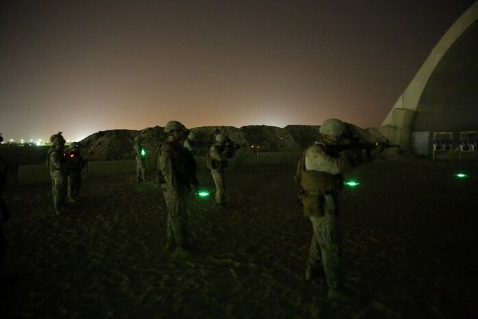 U.S. Marines with Headquarters Company, 3rd Battalion, 7th Marine Regiment, Special Purpose Marine Air-Ground Task Force-Crisis Response-Central Command, fire their rifles during a night range in Southwest Asia, Aug. 8, 2015. These Marines provide security at one of the SPMAGTF operating bases in the Middle East. The Marines and Sailors of SPMAGTF-CR-CC offer rapid, task-organized solutions to the commander of USCENTCOM across an area of operations spanning 20 countries.
