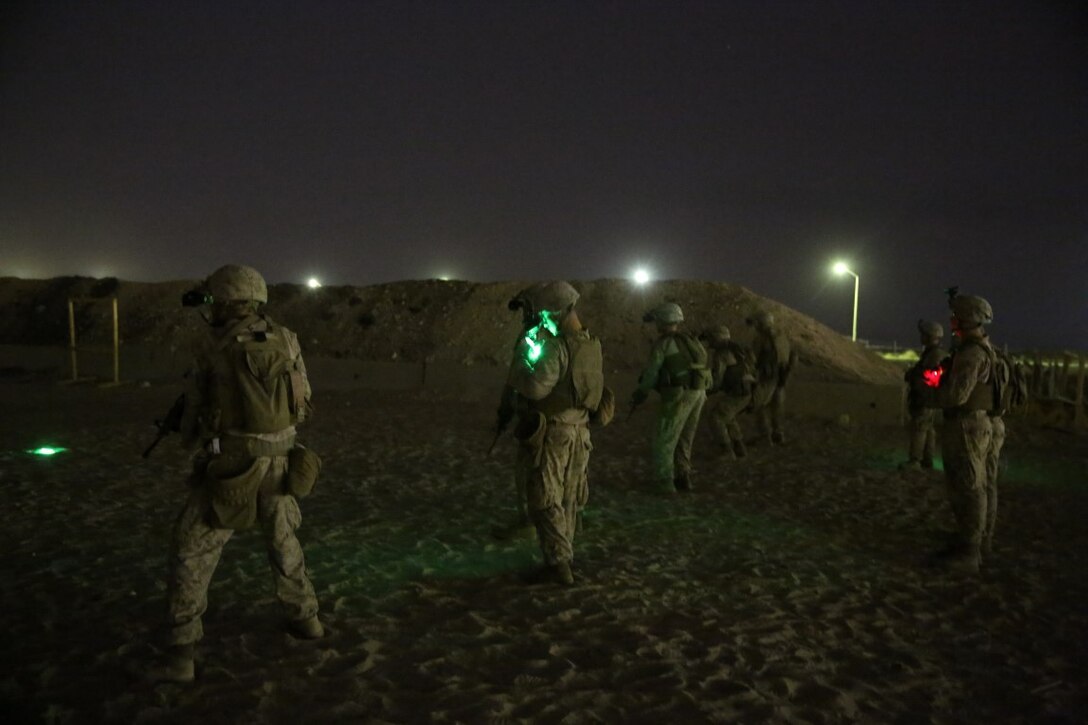 U.S. Marines with Headquarters Company, 3rd Battalion, 7th Marine Regiment, Special Purpose Marine Air-Ground Task Force-Crisis Response-Central Command, await the command to commence firing during a night range in Southwest Asia, Aug. 8, 2015. These Marines provide security at one of the SPMAGTF operating bases in the Middle East. The Marines and Sailors of SPMAGTF-CR-CC offer rapid, task-organized solutions to the commander of USCENTCOM across an area of operations spanning 20 countries.