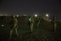 U.S. Marines with Headquarters Company, 3rd Battalion, 7th Marine Regiment, Special Purpose Marine Air-Ground Task Force-Crisis Response-Central Command, await the command to commence firing during a night range in Southwest Asia, Aug. 8, 2015. These Marines provide security at one of the SPMAGTF operating bases in the Middle East. The Marines and Sailors of SPMAGTF-CR-CC offer rapid, task-organized solutions to the commander of USCENTCOM across an area of operations spanning 20 countries.