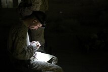U.S. Marine Sgt. Jeffrey Walsh, with Headquarters Company, 3rd Battalion, 7th Marine Regiment, Special Purpose Marine Air-Ground Task Force-Crisis Response-Central Command from Detroit, loads a magazine before shooting at a night range in Southwest Asia, Aug. 8, 2015. The Headquarters Company Marines provide security at one of the SPMAGTF operating bases in the Middle East. The Marines and Sailors of SPMAGTF-CR-CC offer rapid, task-organized solutions to the commander of USCENTCOM across an area of operations spanning 20 countries.