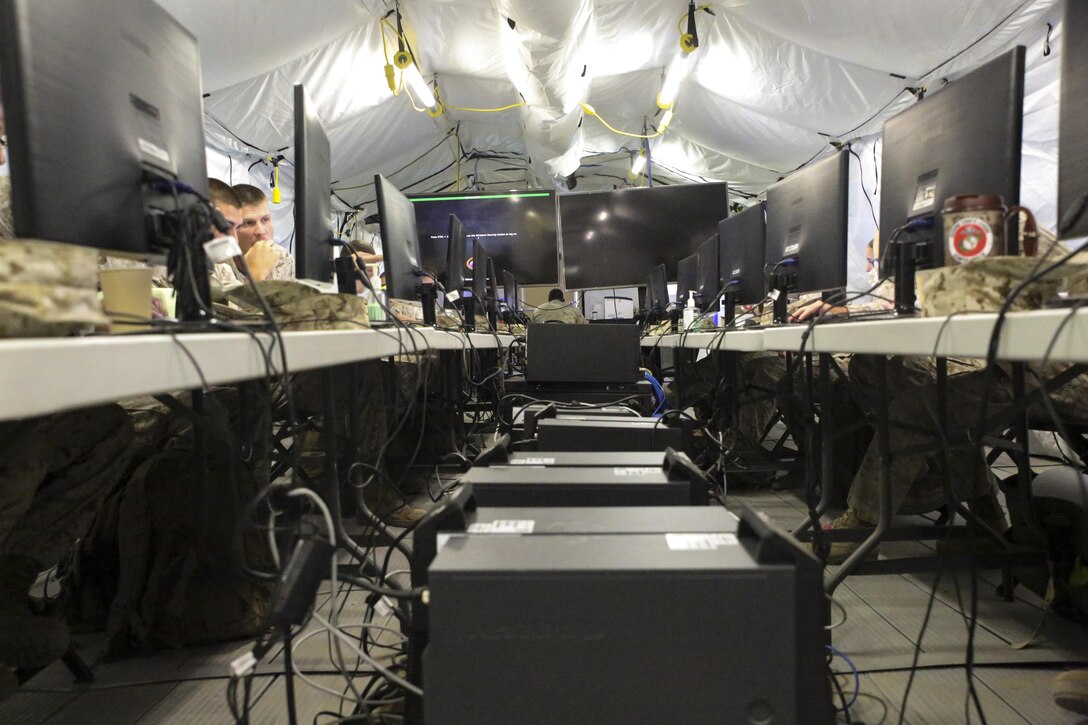 Marines and sailors with Headquarters Regiment, 2nd Marine Logistics Group, conduct a battle skills exercise in preparation to operate on a much larger scale as part of Large Scale Exercise-15 aboard Marine Corps Air Ground Combat Training Center Twentynine Palms, Calif., Aug. 3-6, 2015. LSE-15 is a combined U.S. Marine Corps, Canadian and British exercise conducted at the Brigade-level, designed to enable live, virtual and constructive training for participating forces. 