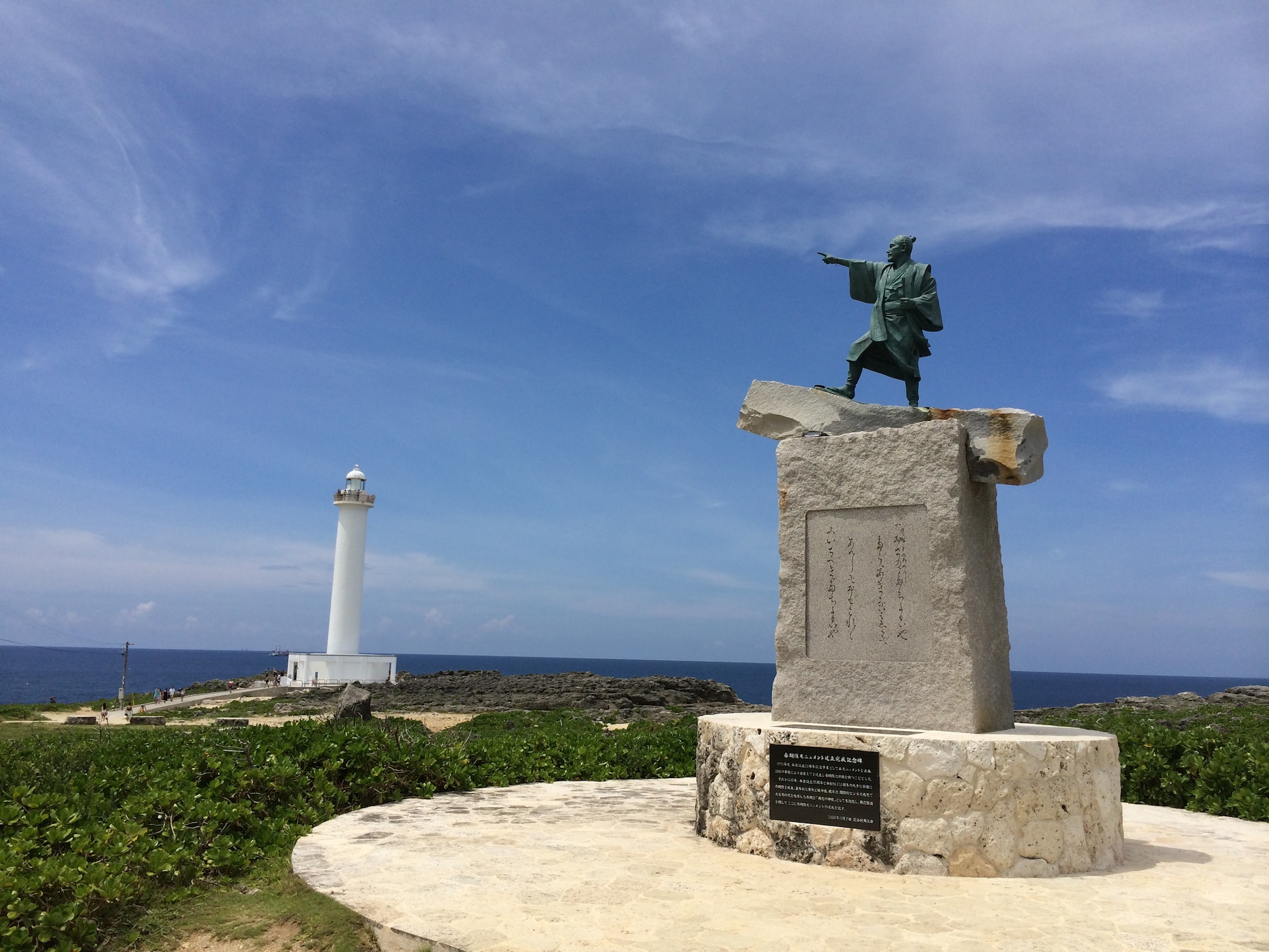 Visitors to Okinawa's Cape Zanpa, just a 20-minute drive from Kadena Air Base, will find this statue of Taiki, the Okinawan man who is believed to have opened tributary trade with China in the 14th century, pointing out past a 100-foot lighthouse toward the East China Sea. (U.S. Air Force photo by Tim Flack)