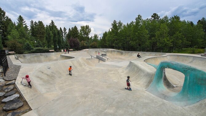 Children skate around the Harshman Skatepark in McCall, Idaho, July 10, 2015. The skatepark was founded by the Tony Hawk Foundation to provide skaters with a safe yet challenging place to ride skateboards, bikes, rollerblades and scooters. (U.S. Air Force photo by Airman 1st Class Connor J. Marth/RELEASED)