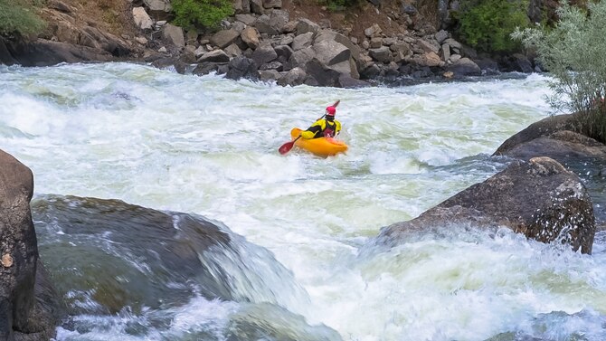 A kayaker paddles his way through whitewater on the North Fork Payette River, Idaho, July 10, 2015. Rafting, tubing and kayaking are some of the most popular activities to do on the river. (U.S. Air Force photo by Airman 1st Class Connor J. Marth/RELEASED)
