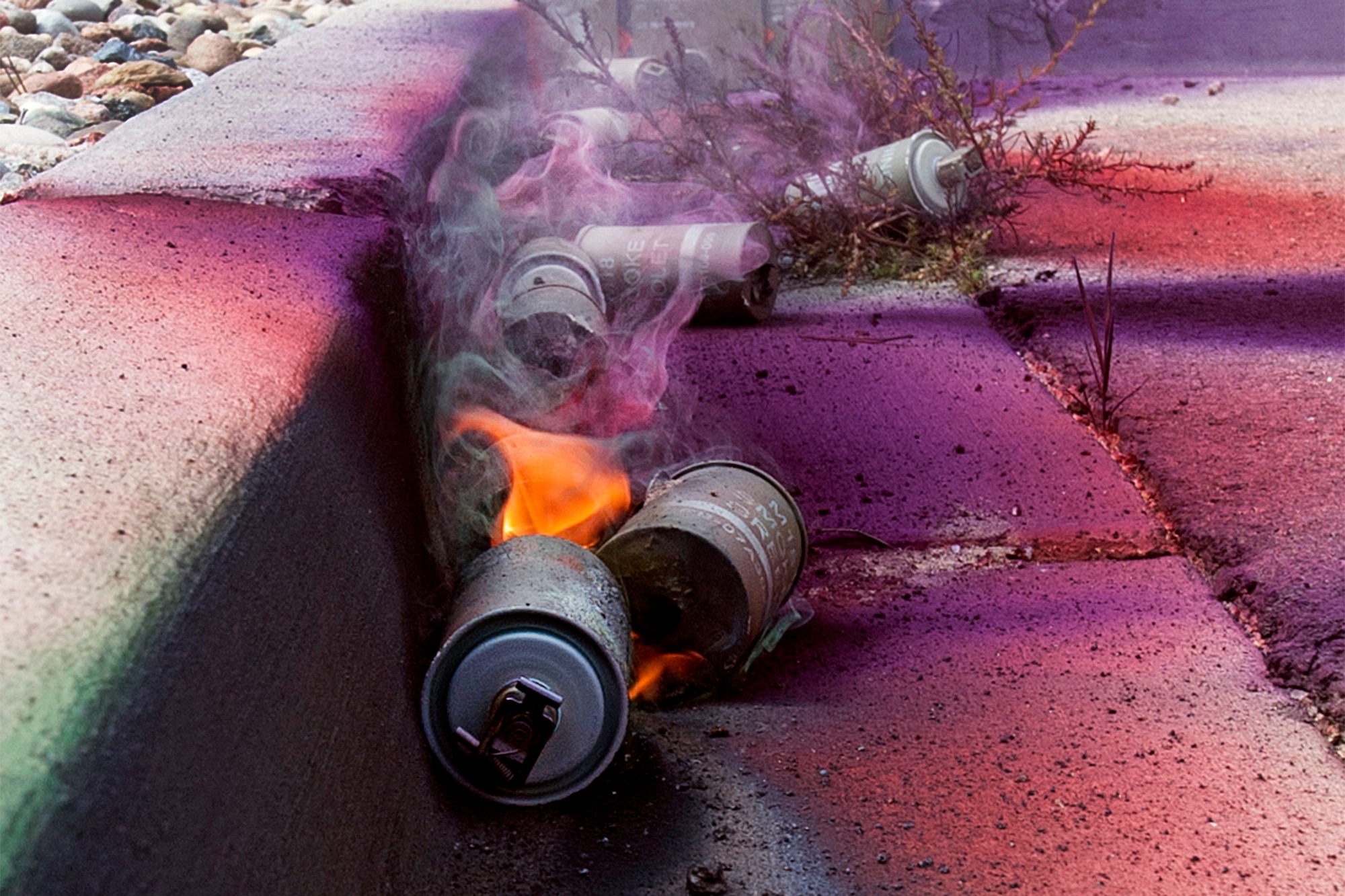 PETERSON AIR FORCE BASE, Colo. - Discharged M18 Smoke Grenades after hands-on training at Cheyenne Mountain Air Force Station.  Expended canisters remain hot for some time after use and should only be picked up while wearing gloves.  Once activated, the grenade produces a cloud of colored smoke for approximately 90 seconds. (Photo by Craig Denton)
