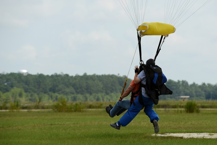 U.S. Air Force Airman 1st Class Ryan Armitage, 20th Force Support Squadron force management technician, is safely brought to the ground after jumping out of an airplane during a 20th FSS skydiving event at Walterboro, S.C., Aug. 1, 2015. Approximately 15 Team Shaw members participated in the second of three skydiving trips. (U.S. Air Force photo by Senior Airman Diana M. Cossaboom/Released)