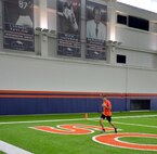 Staff Sgt. Jared Long, 50th Operations Support Squadron, jogs during a warm up prior to the Denver Broncos Military Combine Friday, August 7, 2015, at the Dove Valley Fieldhouse in Englewood, Colorado. Participants showcased their skills in five events – bench press, vertical jump, broad jump, shuttle run and a 40-yard dash during the event. (U.S. Air Force photo/Staff Sgt. Debbie Lockhart)