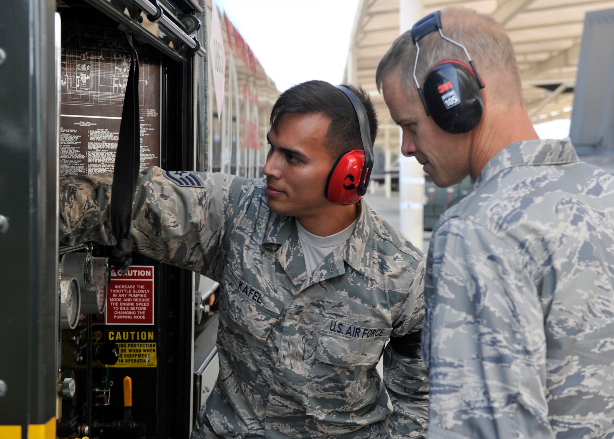 Staff Sgt. Christian Kafel (left), 325th Logistics Readiness Squadron fuels distribution supervisor, explains some of the features of the fuels truck to Col. Derek C. France, 325th Fighter Wing commander Aug. 7 at the Tyndall flightline. Kafel was chosen by his leadership to represent his unit for the Airman Shadow Program. (U.S. Air Force photo by Airman 1st Class Sergio A. Gamboa/Released)