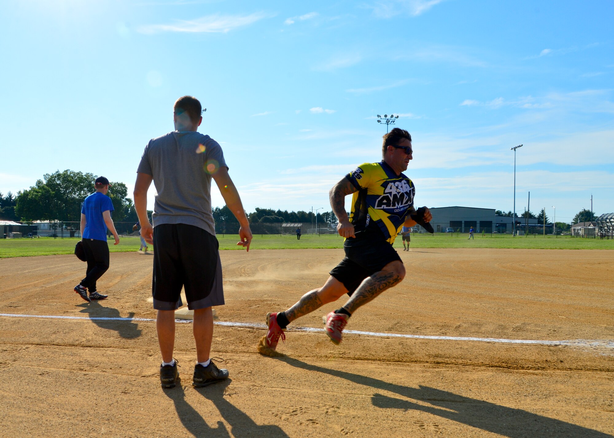 Edward Laurie, 436th Aircraft Maintenance Squadron player-coach, rounds third base and sprints for home during an intramural softball game against the 436th Security Forces Squadron Aug. 3, 2015, at the softball field on Dover Air Force Base, Del. The 436th SFS defeated the 436th AMXS, 8-7. (U.S. Air Force photo/Airman 1st Class William Johnson)