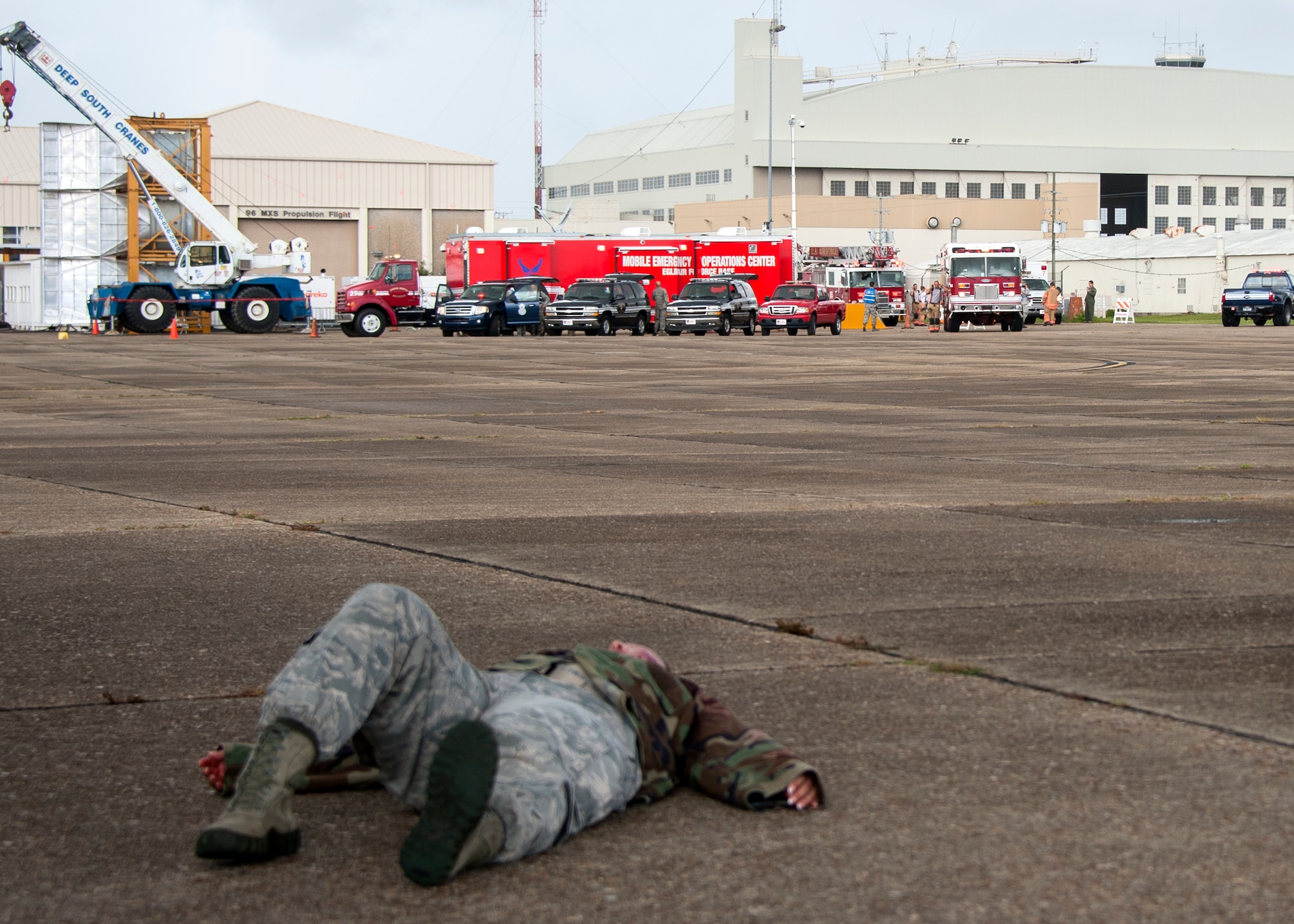 Eglin first responders and their vehicles line the area of the simulated aircraft hijacking scenario ready to rescue the injured during the 96th Test Wing’s force protection condition exercise Aug. 6 at Eglin Air Force Base, Fla.  The FPCON exercise tested the base’s first responders’ rescue skills while the simulated hijacker was apprehended and the injured were moved to safety for treatment. (U.S. Air Force photo/Ilka Cole)