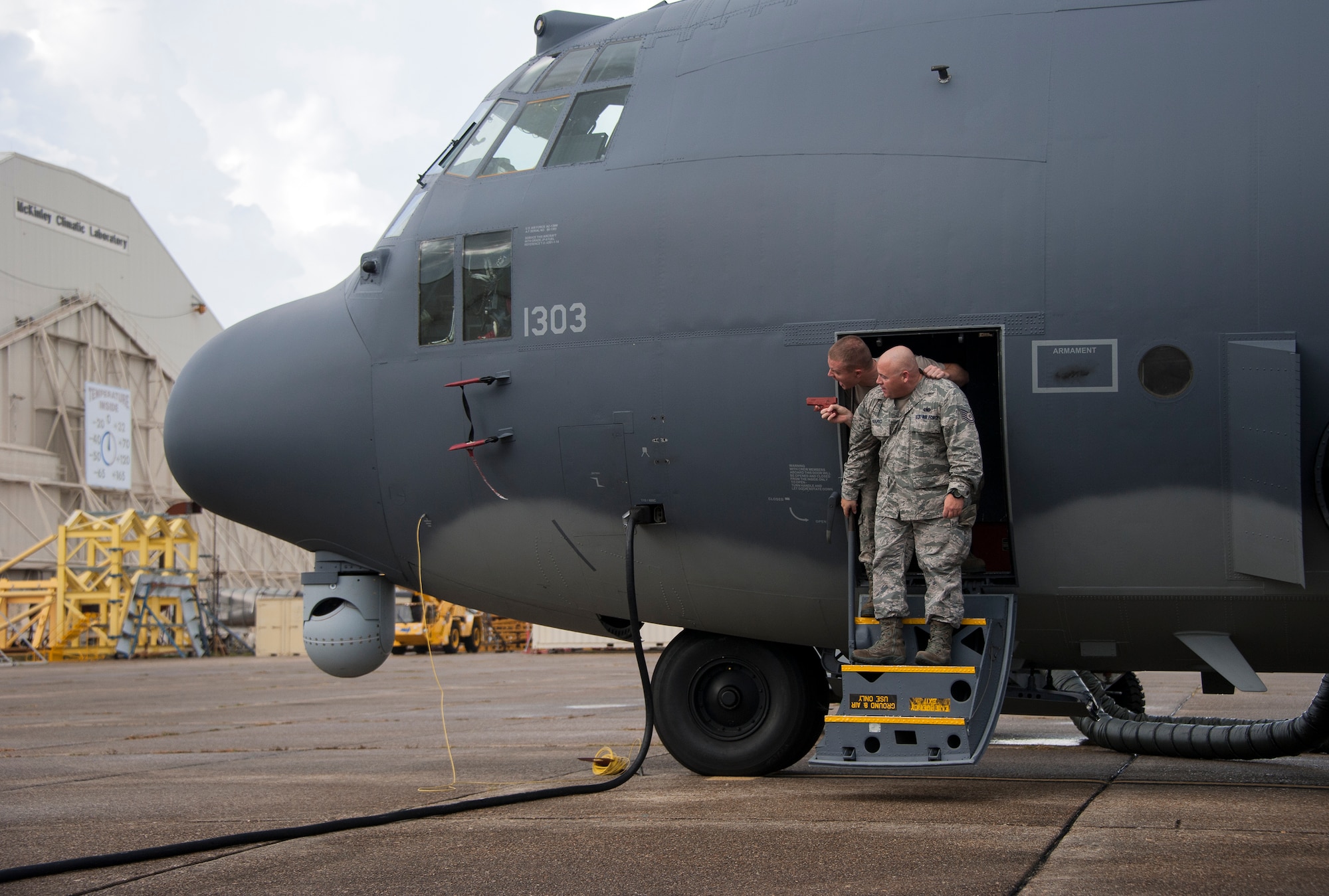 Tech. Sgts. Christopher Cope and Daniel Naro, both of the 96th Logistics Readiness Squadron, participate in a simulated aircraft hijacking scenario during the 96th Test Wing’s force protection condition exercise Aug. 6 at Eglin Air Force Base, Fla.  The FPCON exercise tested the base’s first responders’ rescue skills while the simulated hijacker was apprehended and the injured were moved to safety for treatment. (U.S. Air Force photo/Ilka Cole)