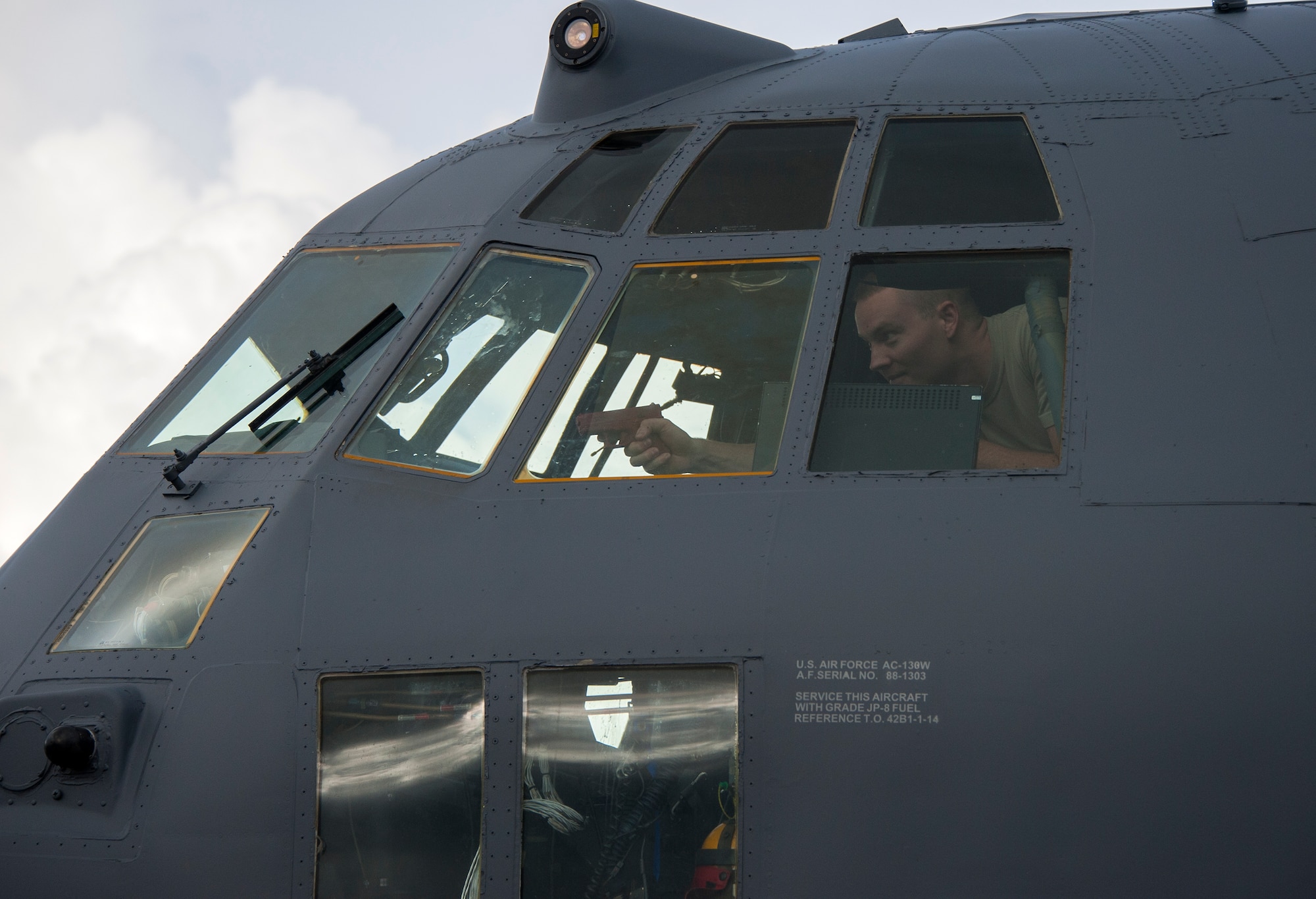 Tech. Sgt. Christopher Cope, 96th Logistics Readiness Squadron, acts as a hijacker and points a rubber gun at security forces in a simulated aircraft hijacking scenario as part of the 96th Test Wing’s force protection condition exercise Aug. 6 at Eglin Air Force Base, Fla.  The FPCON exercise tested the base’s first responders’ rescue skills while the simulated hijacker was apprehended and the injured were moved to safety for treatment. (U.S. Air Force photo/Ilka Cole)