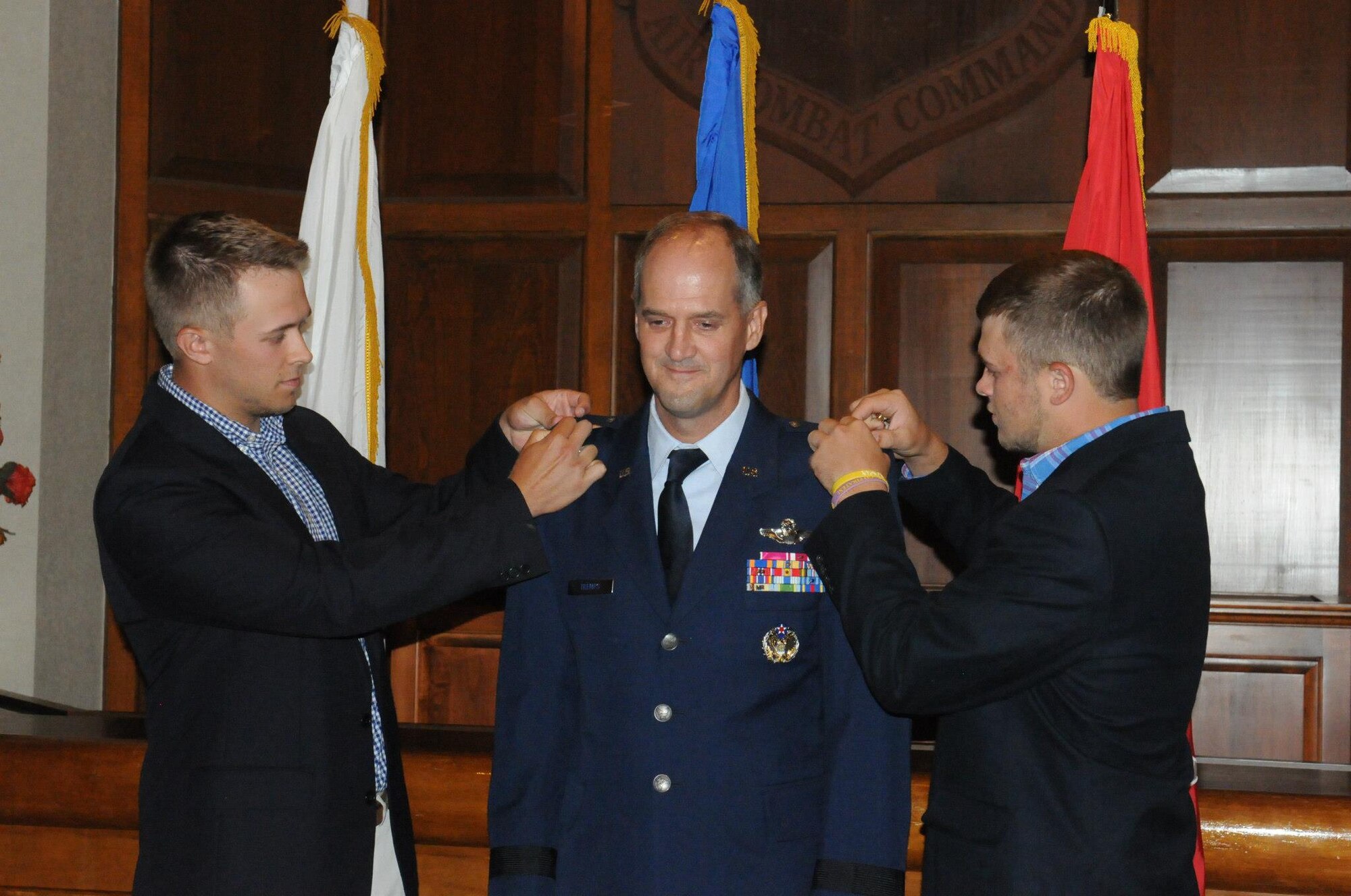 Maj. Gen. Timothy P. Williams, the Adjutant General of Virginia, promotes Brig. Gen. Dean A. Tremps, Air Component Commander of the Virginia National Guard, during a ceremony held Aug. 9, 2015 at Joint Base Langley-Eustis. Tremps assumed command of the Virginia ANG effective May 27, 2015. (U.S. Air National Guard photo by 1st. Lt. M. Selki/Released)