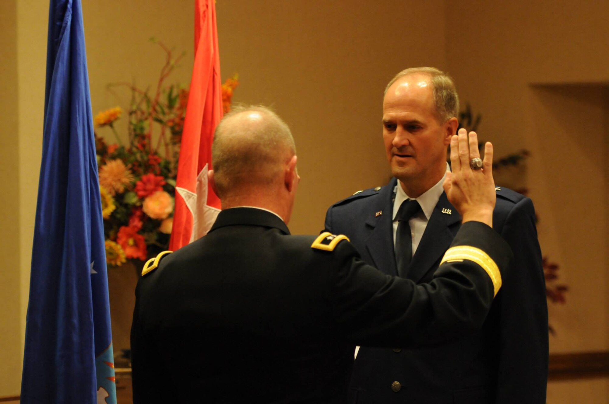 Maj. Gen. Timothy P. Williams, the Adjutant General of Virginia, promotes Brig. Gen. Dean A. Tremps, Air Component Commander of the Virginia National Guard, during a ceremony held Aug. 9, 2015 at Joint Base Langley-Eustis. Tremps assumed command of the Virginia ANG effective May 27, 2015. (U.S. Air National Guard photo by Tech. Sgt. Meghan Skrepenski/Released)