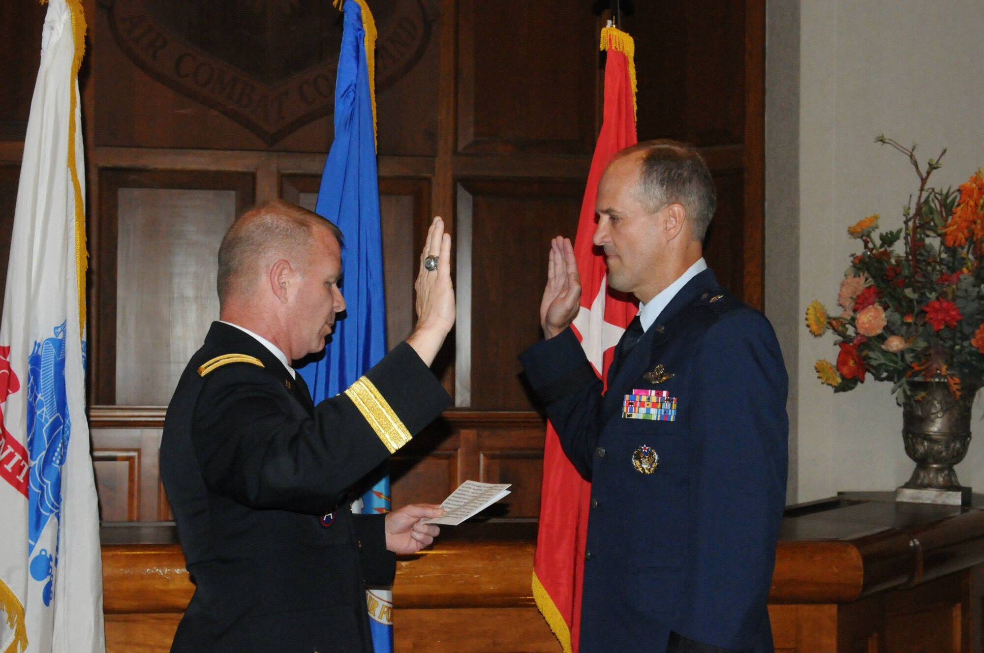 Maj. Gen. Timothy P. Williams, the Adjutant General of Virginia, promotes Brig. Gen. Dean A. Tremps, Air Component Commander of the Virginia National Guard, during a ceremony held Aug. 9, 2015 at Joint Base Langley-Eustis. Tremps assumed command of the Virginia ANG effective May 27, 2015. (U.S. Air National Guard photo by 1st. Lt. M. Selki/Released)