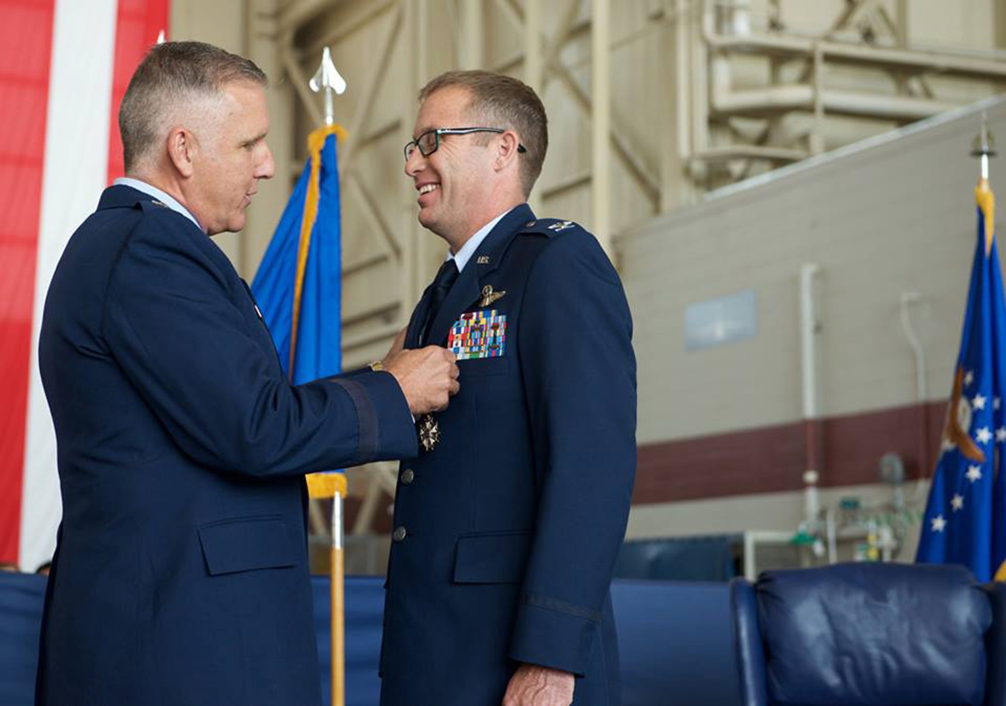 Col. Matthew J. Burger, outgoing commander of the 349th Air Mobility Wing, receives the Legion of Merit medal from Maj. Gen. John C. Flournoy, Jr., 4th Air Force commander, during a change of command ceremony Aug. 8, 2015 at Travis Air Force Base. Burger will assume duties in the Pentagon as the Programs and Requirements Division chief, Air Force Reserve Command (U.S. Air Force photo/Ken Wright)