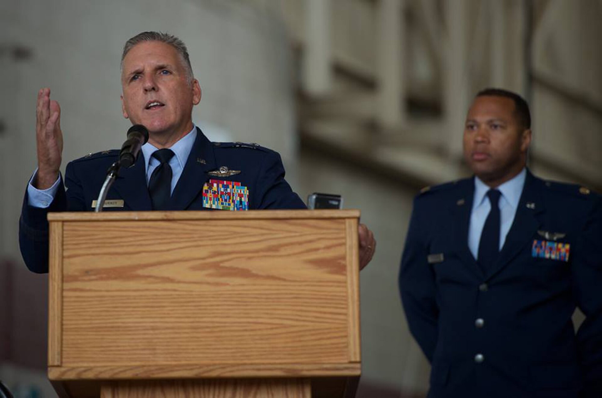 Maj. Gen. John C. Flournoy, Jr., Commander, 4th Air Force, speaks to Team Travis and community leaders during the 349th Air Mobility Wing Change of Command ceremony at Travis Air Force Base, Calif., Aug. 8, 2015. General Flournoy was the presiding officer in the ceremony where Col. Raymond A. Kozak assumed command of the 349th Air Mobility Wing from Col. Matthew J. Burger. Kozak will lead more than 3,100 combat-ready Citizen Airmen, flying and maintaining the C-17 Globemaster III, C-5 Galaxy and KC-10 Extender mobility aircraft. Col. Matthew J. Burger, outgoing 349th AMW commander, will assume duties in the Pentagon as the Programs and Requirements Division chief, Air Force Reserve Command. (U.S. Air Force photo/Ken Wright)