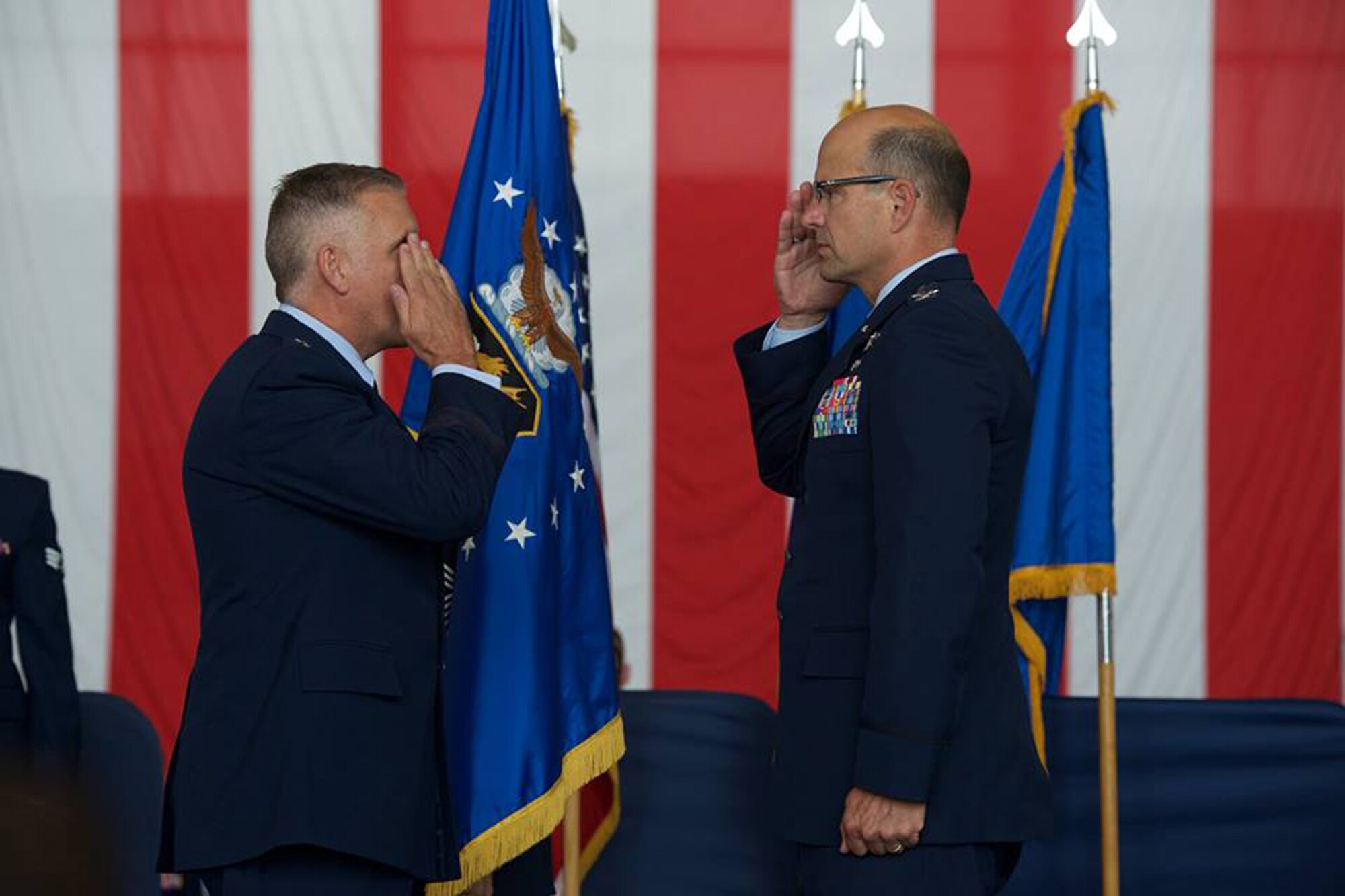 Col. Raymond A. Kozak takes command of the 349th Air Mobility Wing from outgoing commander, Col. Matthew J. Burger, during a change of command ceremony Aug. 8, 2015 at Travis Air Force Base. Maj. Gen. John C. Flournoy, Jr., 4th Air Force commander, presides over the ceremony. Kozak will lead more than 3,100 combat-ready Citizen Airmen, flying and maintaining the C-17 Globemaster III, C-5 Galaxy and KC-10 Extender mobility aircraft. (U.S. Air Force photo/Ken Wright)