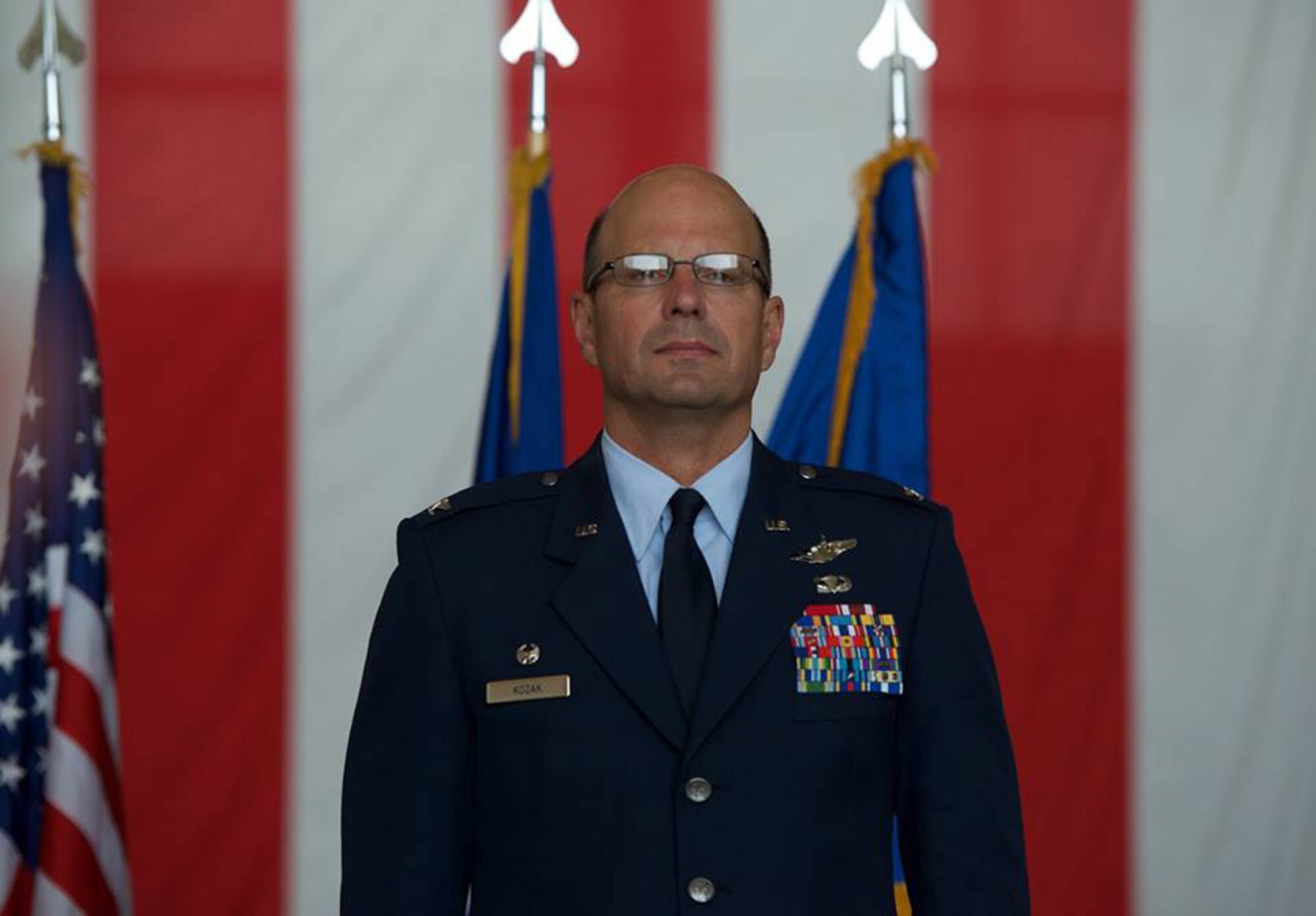 Col. Raymond A. Kozak takes command of the 349th Air Mobility Wing from outgoing commander, Col. Matthew J. Burger, during a change of command ceremony Aug. 8, 2015 at Travis Air Force Base, Calif. Maj. Gen. John C. Flournoy, Jr., 4th Air Force commander, presides over the ceremony. Kozak will lead more than 3,100 combat-ready Citizen Airmen, flying and maintaining the C-17 Globemaster III, C-5 Galaxy and KC-10 Extender mobility aircraft. (U.S. Air Force photo/Ken Wright)