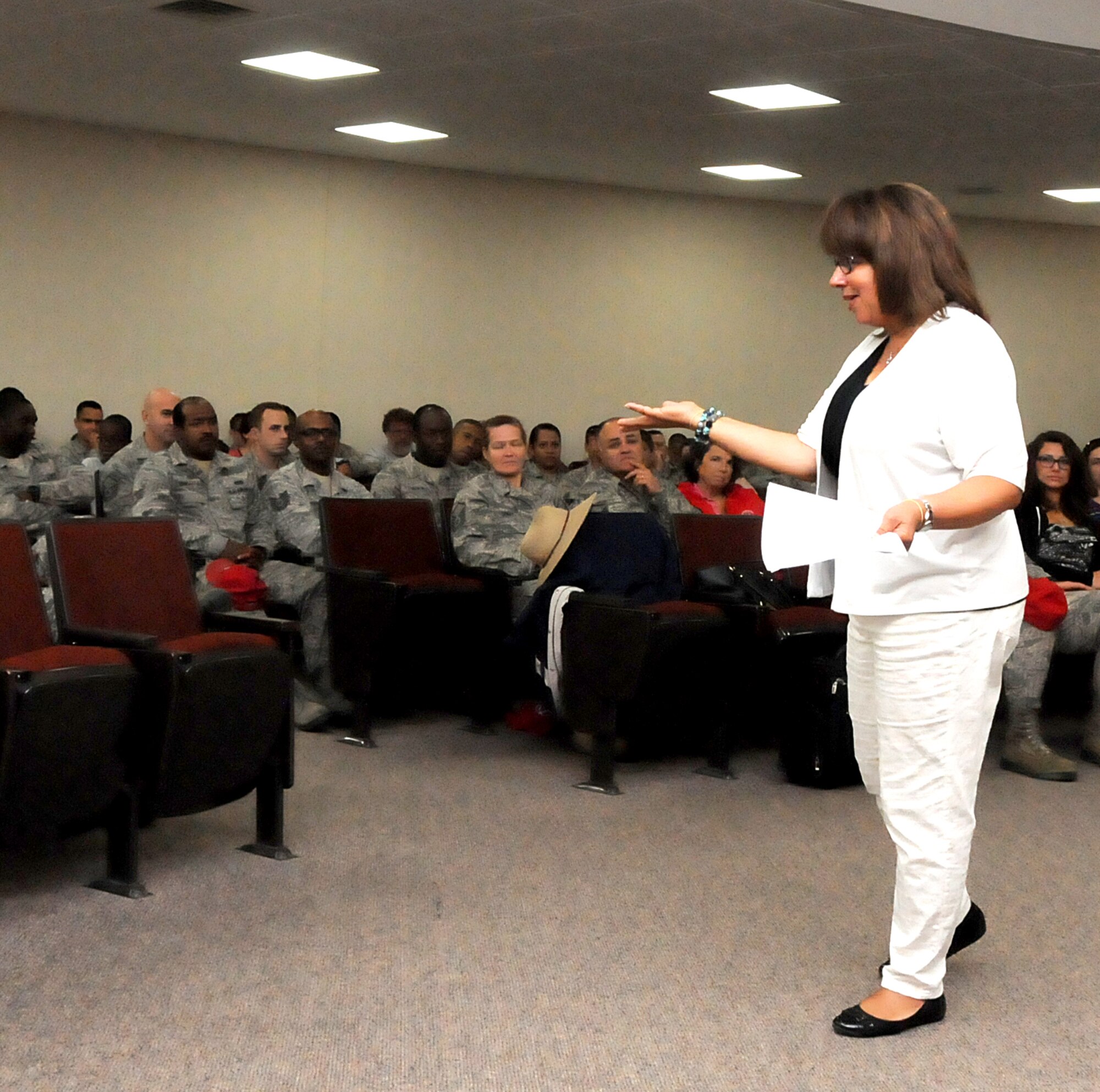 Ms. Angelia Wade, 192D Fighter Wing Airman and Family Readiness Director, briefs the 203rd Red Horse Squadron members and their families on the resources and programs available through her office during an event held at the State Military Reservation, Camp Pendleton, Virginia Beach, Virginia, August 8, 2015. The brief was built into the 203rd Red Horse Squadron Annual Family Day event. Wade discussed the Yellow Ribbon Program,  Employer Support of the Guard and Reserve (ESGR) program, financial assistance and employment resources and the key spouse volunteer program. (U.S. Air National Guard photo by Capt. Craig Carper/Released)