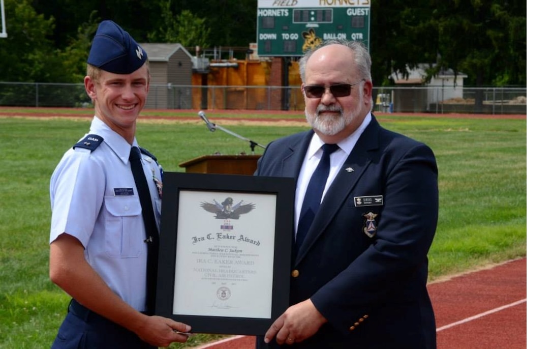 Cadet Lt. Col. Matthew Jackson, left, receives the Ira C. Eaker Award at the 2015 New Jersey Wing Basic Encampment graduation on Saturday. Presenting the award to Jackson is Northeast Region Vice Commander South, Col. Joseph Sirois. Earlier today, Jackson learned that he is also the 2000th recipient of the Gen. Carl A. Spaatz Award – CAP’s highest cadet honor – that carries with it a promotion to cadet colonel.