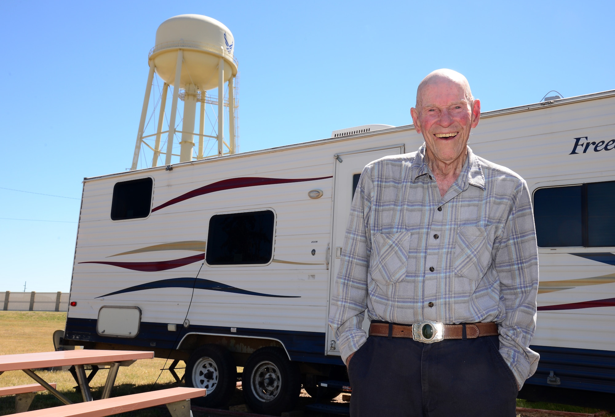 William “Bill” Miller stands in front of his camper, Aug. 7, 2015, at the Malmstrom Air Force Base, Mont., campground. Miller has survived three American wars, and hopes to return to Malmstrom next summer. (U.S. Air Force photo/Airman 1st Class Magen M. Reeves)