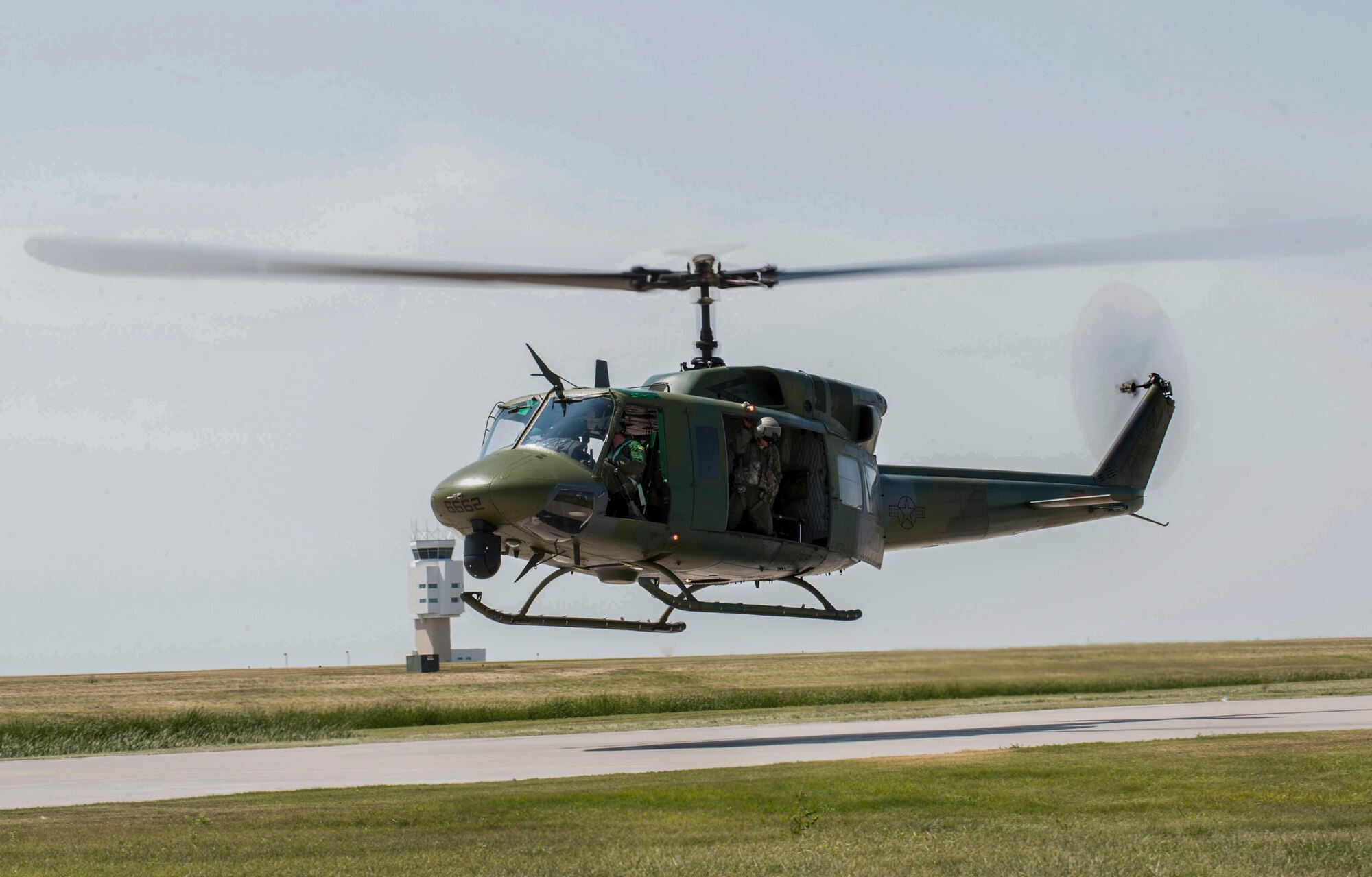 A UH-1N Helicopter from the 54th Helicopter Squadron takes off for a training mission at Minot Air Force Base, N.D., Aug. 4, 2015. The 54th HS will compete against two other helicopter squadron teams, the 37th HS from Francis E. Warren AFB, Wyoming and 40th HS from Malmstrom AFB, Montana, in Air Force Global Strike Command. (U.S. Air Force photo/Senior Airman Stephanie Morris)
