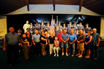 Members of the 22nd Air Refueling Wing and 184th Intelligence Wing Honor Guards pose with Verna Welsh, center, and her family members, Aug. 10, 2015, in Wichita, Kan. The honor guard team refolded two memorial flags for her brothers Staff Sgt. Dale Francis and Pfc. Paul Edward Kingsley, who both died during World War II. (U.S. Air Force photo by Senior Airman Victor J. Caputo)