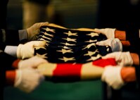 22nd Air Refueling Wing and 184th Intelligence Wing Honor Guard Airmen fold a 48-star American Flag, Aug. 10, 2015, in Wichita, Kan. The flag and one other were presented to the family of Staff Sgt. Dale Francis and Pfc. Paul Edward Kingsley when they died in 1943 and 1944, respectively, during World War II. The American flag contained only 48 stars until 1959, when Alaska and Hawaii were admitted as the 49th and 50th states in the union, respectively. (U.S. Air Force photo by Senior Airman Victor J. Caputo)