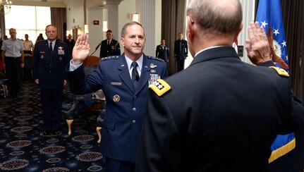 Gen. David L. Goldfein is given the Oath of Office by Chairman of the Joint Chiefs of Staff Gen. Martin Edward "Marty" Dempsey during his promotion ceremony Aug. 6, 2015, in Washington, D.C.  Goldfein will become the Air Force's 38th Vice Chief of Staff, and most recently served as the director of the Joint Staff.  (U.S. Air Force photo/Scott M. Ash)