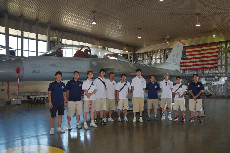 Aomori WATS basketball players pose for a group photo in front of an F-16 Fighting Falcon at Misawa Air Base, Japan, Aug. 5, 2015. During their tour, the players learned about the teamwork it takes for Airmen across the 35th Fighter Wing to ensure mission success. (U.S. Air Force photo by Senior Airman Jose L. Hernandez-Domitilo/Released)