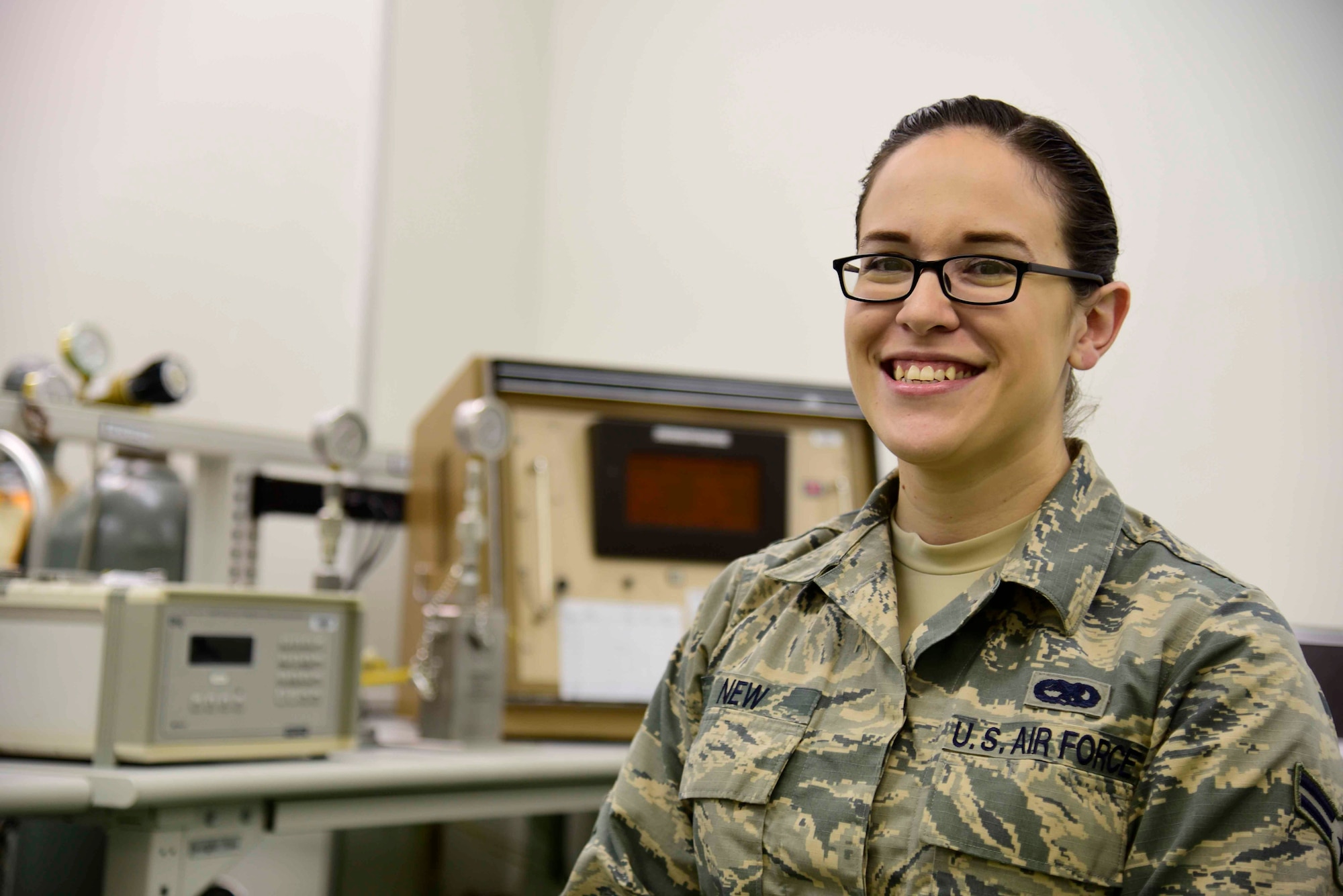 U.S. Air Force Airman 1st Class Emily New, 35th Maintenance Squadron precision measurement equipment laboratory journeyman, poses for a picture at Misawa Air Base, Japan, Aug. 6, 2015. New’s daily duty is to calibrate, repair, troubleshoot, inspect and test measurement and diagnostic equipment using inches, pounds per square inch, voltage and frequency. (U.S. Air Force photo by Airman 1st Class Jordyn Fetter/Released)