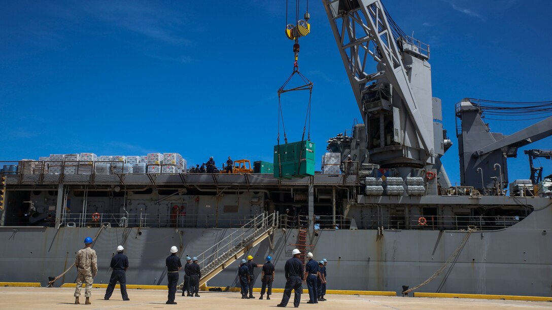 U.S. Marines and sailors with the 31st Marine Expeditionary Unit and the USS Ashland offload relief supplies from the ship for typhoon recovery efforts in Saipan, Aug. 8, 2015. The MEU and the ships of the Bonhomme Richard Amphibious Ready Group will assist the Federal Emergency Management Agency in delivering the supplies to the victims of Typhoon Soudelor in Saipan. The island, part of the Commonwealth of the Northern Mariana Islands, was struck by the typhoon Aug. 2-3. 