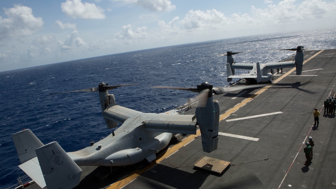 Two MV-22B Ospreys prepare to take off from the flight deck of the USS Bonhomme Richard (LHD 6), Aug. 8, 2015. The 31st MEU is staging Ospreys in Guam in support of typhoon recovery efforts in Saipan. The aircraft will be on standby in the event their aerial lift capacity is needed to deliver emergency supplies to remote areas. Saipan, the most populated island in the Commonwealth of the Northern Mariana Islands, was struck by Typhoon Soudelor Aug. 2-3.  