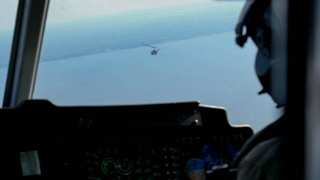 A UH-1Y Huey flies with an AH-1W Super Cobra during a training exercise testing a digital interoperability system at Marine Corps Air Station Cherry Point, N.C., July 24, 2015. Digital interoperability is the technology capable of increasing prowess on the battlefield. The exercise included Marine Light Attack Helicopter Squadron 467, Marine Unmanned Aerial Vehicle Squadron 2, and U.S. Marine Corps Forces, Special Operations Command, testing a LINK 16 conversion system for one of the first times within an explicitly rotary-wing exercise.