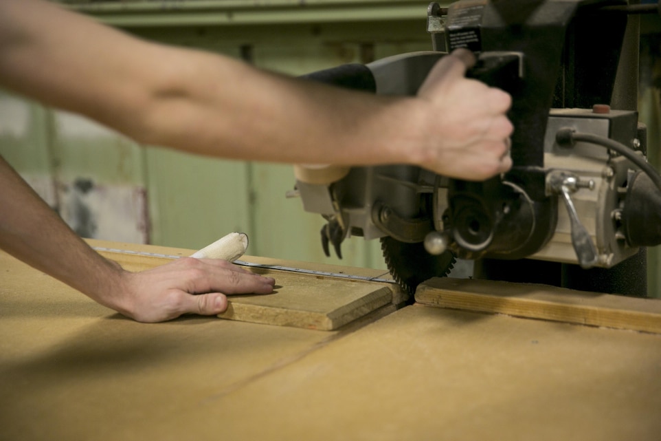 Joseph Viscuso, recreation attendant, Combat Center’s Wood Hobby Shop, instructs patrons on the proper use of tools and machines during a safety class at the Combat Center’s Wood Hobby Shop, August 8, 2015. For those interested in woodworking, the shop has the tools needed to build, repair or modify their own woodwork, craft and hobby items. (Official Marine Corps photo by Pfc. Levi Schultz/Released)