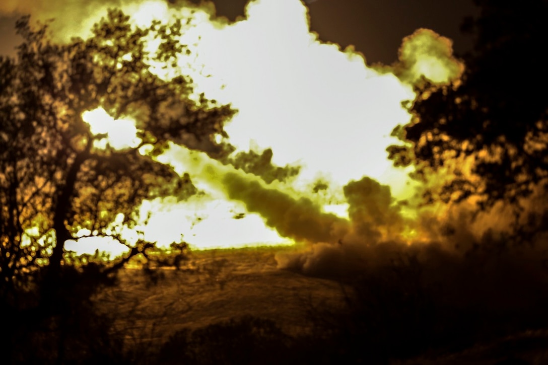 Marines with 5th Battalion, 11th Marine Regiment, 1st Marine Division, fire an M142 High-Mobility Artillery Rocket System as part of SUMMER FIREX, an 11th Marine Regiment exercise aboard Marine Corps Base Camp Pendleton, Calif., Aug. 9, 2015. The two Brazilian officers visited to share and discuss information on military operations, unit structure and different weapons systems.