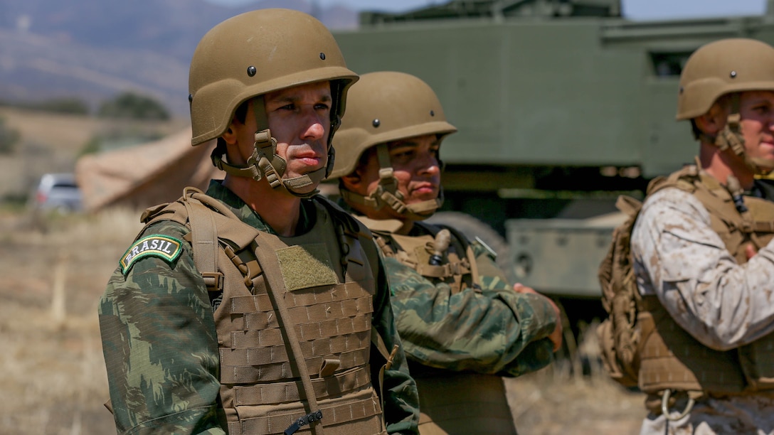 Brazilian Major Rafael Pires Ferreira, an artillery officer with Corpo de Fuzileiros Navais, observes the tactical capabilities of 5th Battalion, 11th Marine Regiment’s M142 High-Mobility Artillery Rocket System aboard Marine Corps Base Camp Pendleton, Calif., Aug. 9, 2015. The two Brazilian officers visited to share and discuss information on military operations, unit structure and different weapons systems.