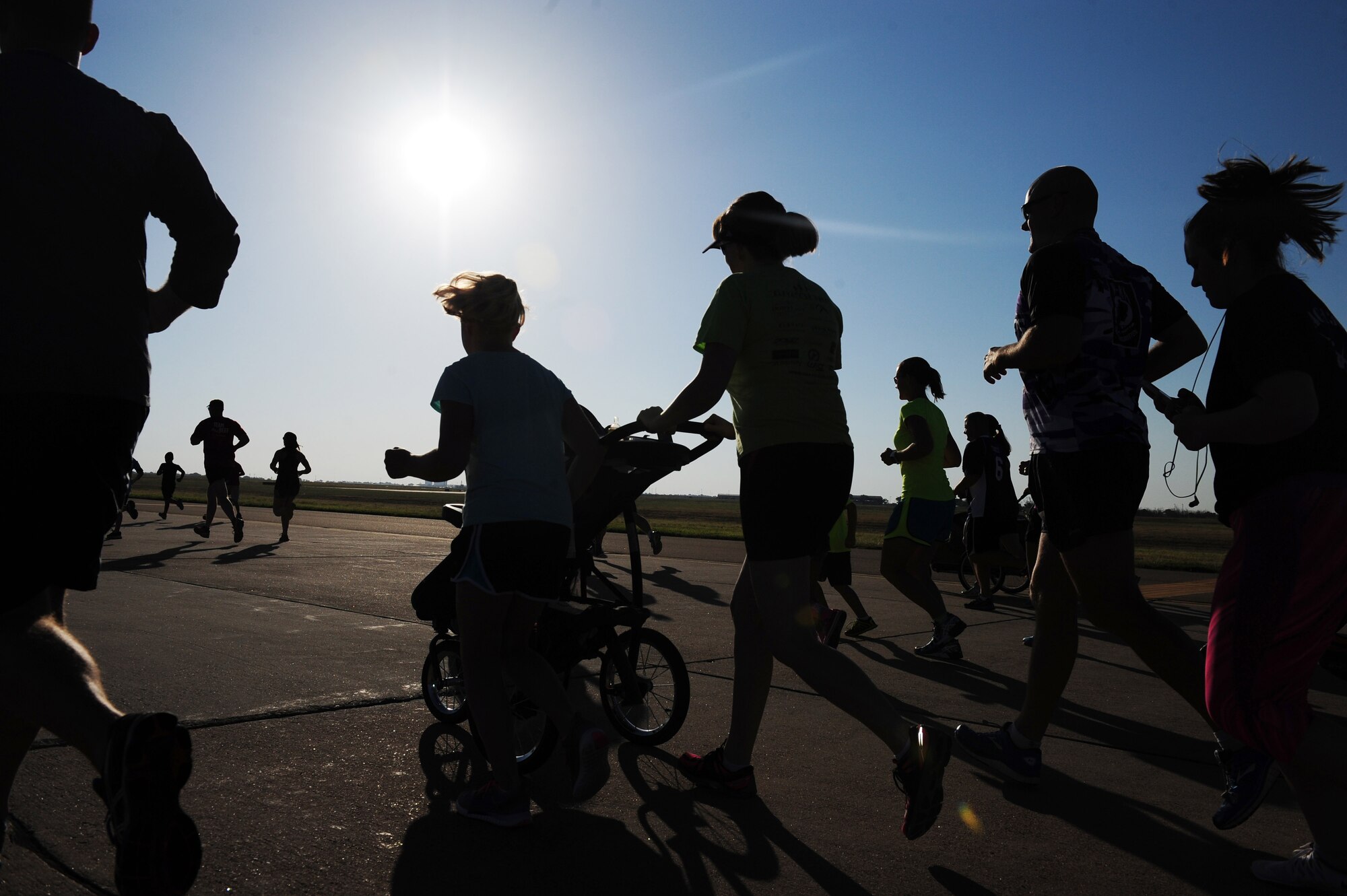 Participants of the 5K "Run Forest, Run" event start the race during the 2015 “Rockin the High Planes” Open House, Aug. 8, 2015 at Cannon Air Force Base, N.M. The race was the first of many free events that were open to both service members and the community. (U.S. Air Force photo/Tech. Sgt. Manuel Martinez)