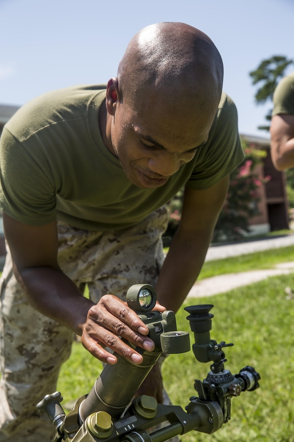 Lance Cpl. William Emory, a mortarman with 1st Battalion, 8th Marine Regiment adjusts the sight on the M224 60 mm Mortar Lightweight Company Mortar System during a 10-day long 60 mm Mortar Lightweight Company Mortar System course under the direction of the Division Combat Skills Center aboard Camp Lejeune, N.C., Aug. 10, 2015. The course began with classroom instruction over the weapons system in which they learned how to boresight, misfire procedures and deflection changes for elevation before the unit moves into live-fire. (U.S. Marine Corps photo by Cpl. Krista James/Released)