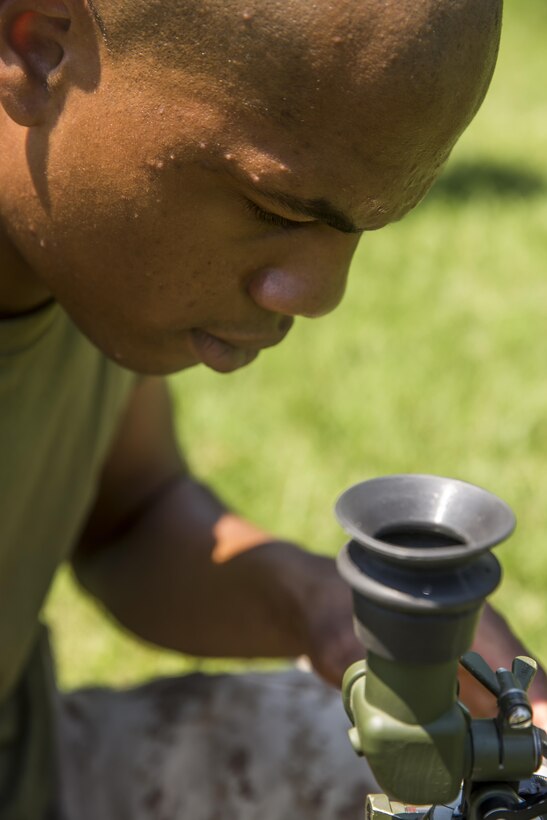 Lance Cpl. William Emory, a mortarman with 1st Battalion, 8th Marine Regiment looks through the sight on the M224 60 mm Mortar Lightweight Company Mortar System during a 10-day long 60 mm Mortar Lightweight Company Mortar System (LCMS) course under the direction of the Division Combat Skills Center (DCSC) aboard Camp Lejeune, N.C., Aug. 10, 2015. The course began with classroom instruction over the weapons system in which they learned how to boresight, misfire procedures, and deflection changes for elevation before the unit moves into live-fire. (U.S. Marine Corps photo by Cpl. Krista James/Released)