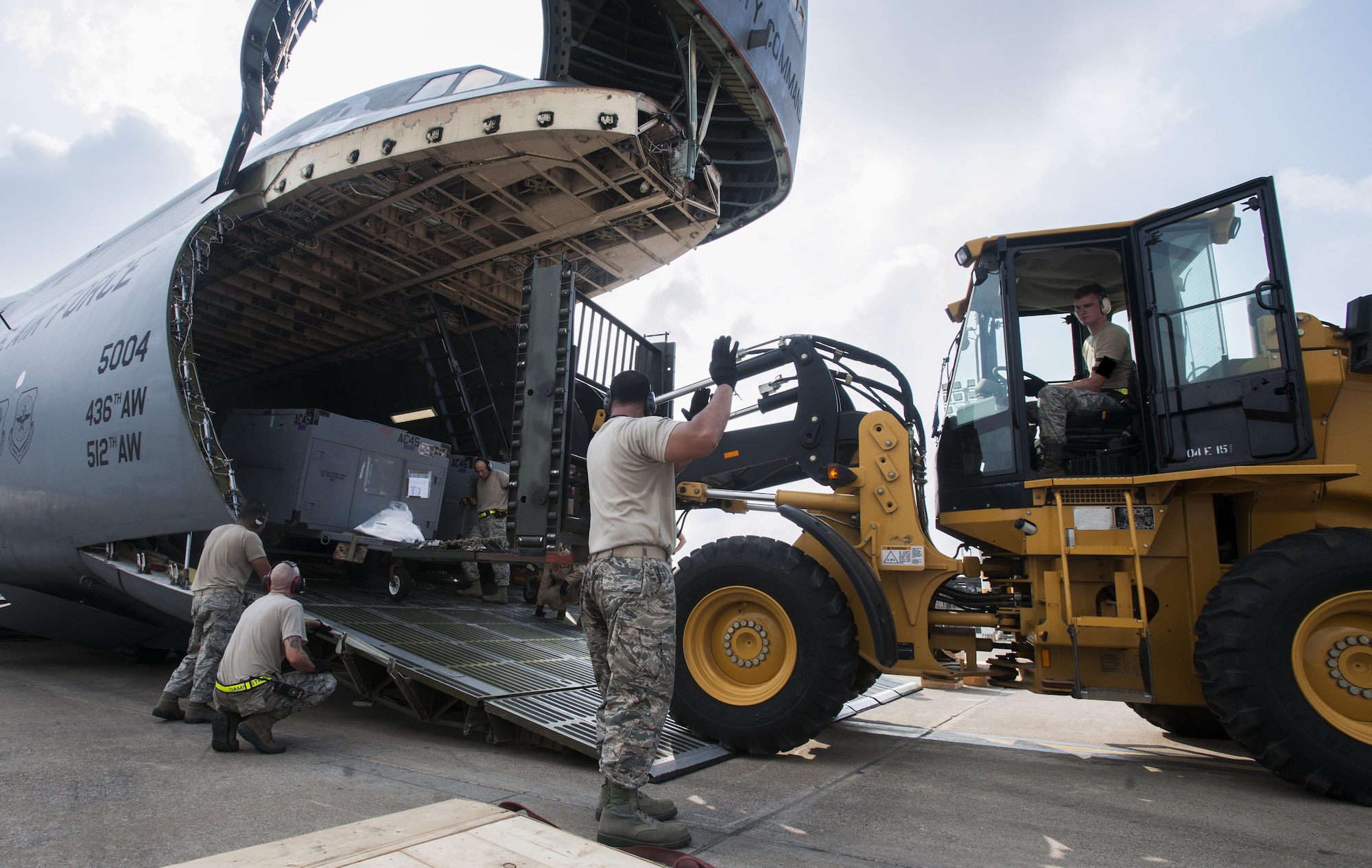 Airmen from the 39th Logistics Readiness Squadron and the 728th Air Mobility Squadron unload equipment from a C-5M Super Galaxy from Dover Air Force Base, Del. in support of Operation Inherent Resolve Aug. 9, 2015, at Incirlik Air Base, Turkey. The U.S. Air Force deployed six F-16 Fighting Falcons from Aviano Air Base, Italy, support equipment and approximately 300 personnel to Incirlik AB. (U.S. Air Force photo by Senior Airman Krystal Ardrey/Released