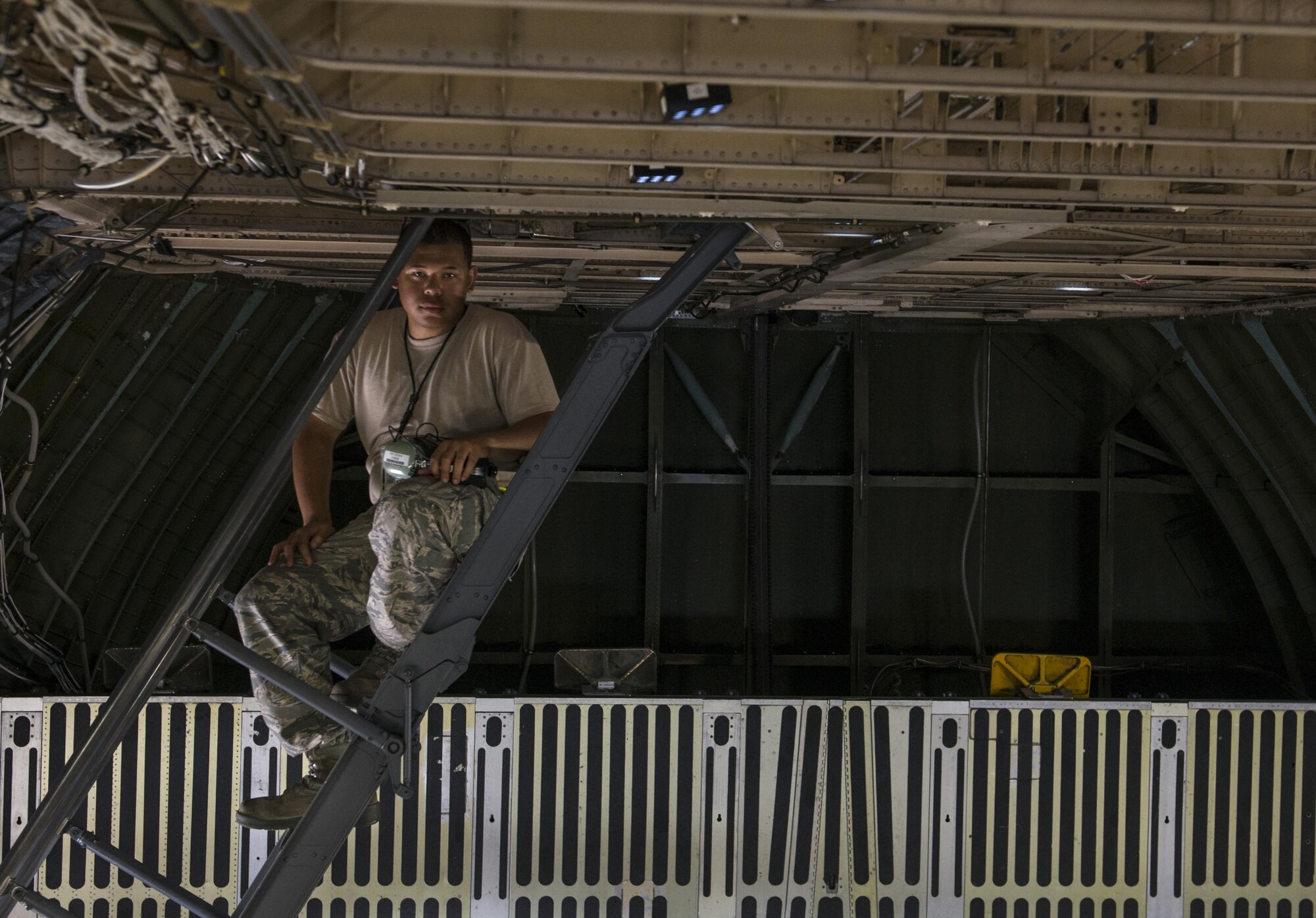 An Airman from the 728th Air Mobility Squadron sits inside a C-5M Super Galaxy arrived from Dover Air Force Base, Del. Aug. 9, 2015, at Incirlik Air Base, Turkey. The U.S. and Turkey, as members of the 60-plus nation coalition, are committed to the fight against ISIL in pursuit of peace and stability in the region. (U.S. Air Force photo by Senior Airman Krystal Ardrey/Released)