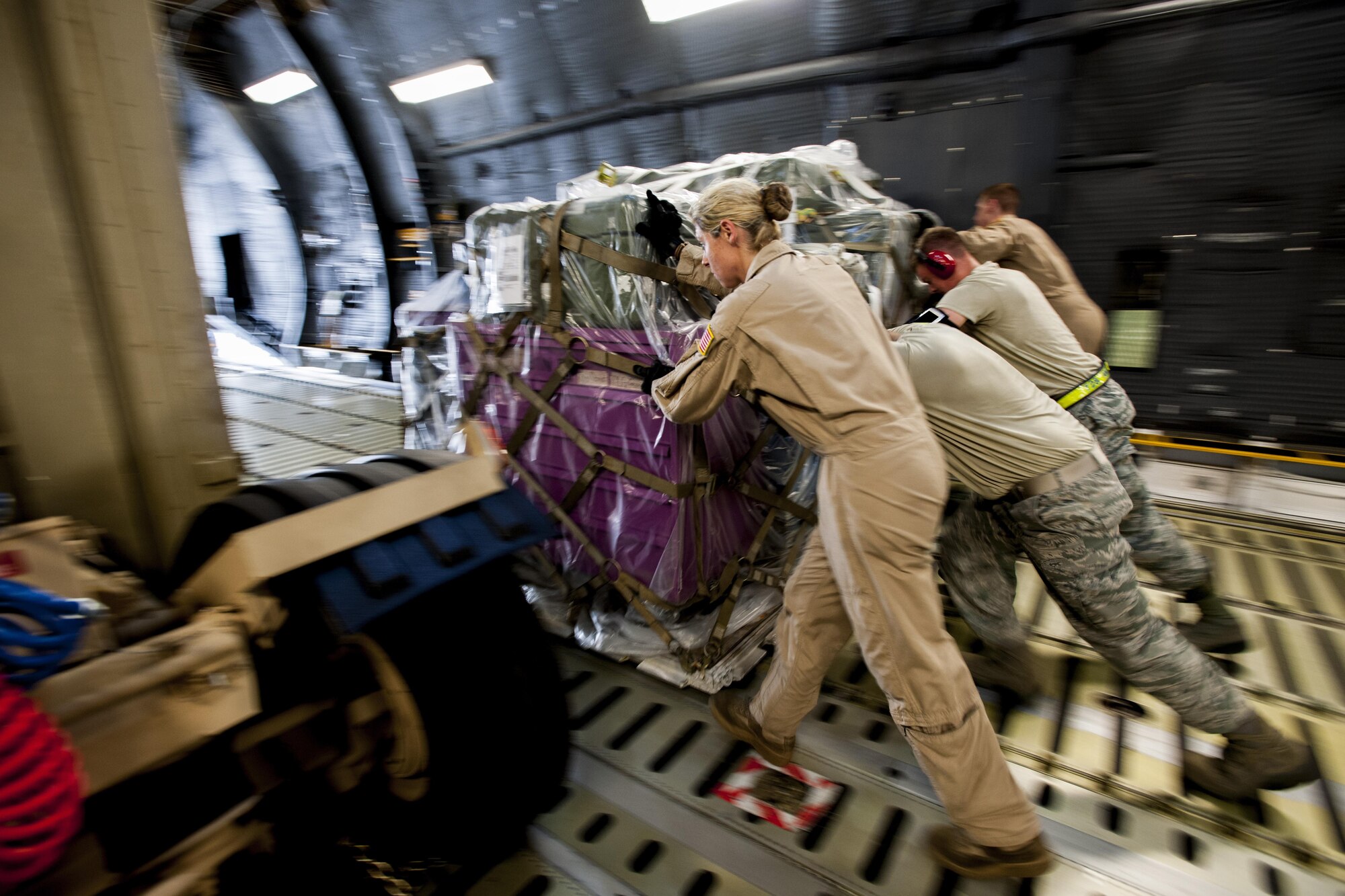 Airmen from the 39th Logistics Readiness Squadron, the 728th Air Mobility Squadron and the 9th Airlift Squadron unload equipment from a C-5M Super Galaxy from Dover Air Force Base, Del. in support of Operation Inherent Resolve Aug. 9, 2015, at Incirlik Air Base, Turkey. The U.S. Air Force deployed six F-16 Fighting Falcons from Aviano Air Base, Italy, support equipment and approximately 300 personnel to Incirlik AB. (U.S. Air Force photo by Senior Airman Krystal Ardrey/Released) 