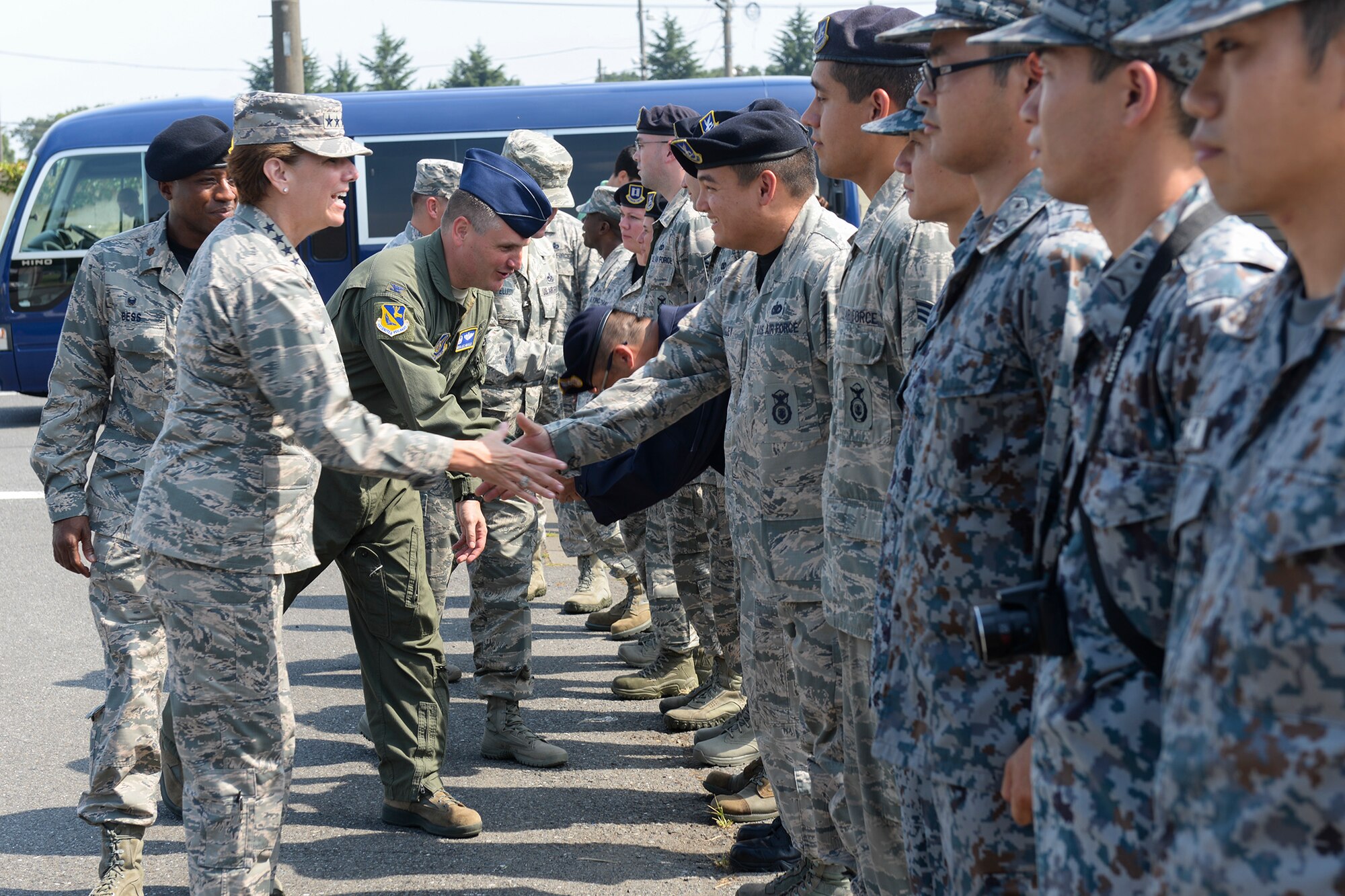 U.S. Air Force Gen. Lori Robinson, Pacific Air Forces commander, meets the 374th Security Forces Squadron canine unit at Yokota Air Base, Japan, Aug. 6, 2015. Robinson met and spoke with Airmen at several notable facilities as part of her visit to Yokota. (U.S. Air Force photo by Airman 1st Class Elizabeth Baker/Released)
