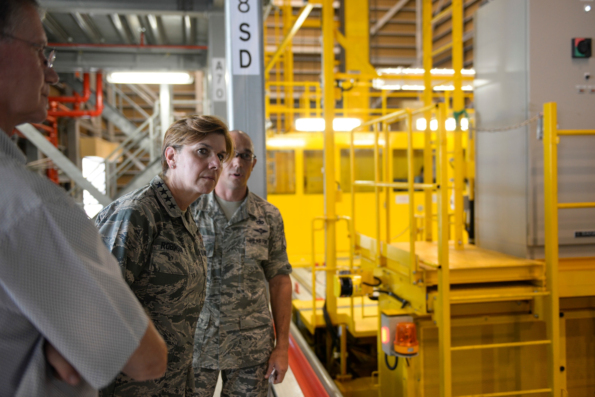 U.S. Air Force Gen. Lori Robinson, Pacific Air Forces commander, visits the Mechanized Material Handling System at Yokota Air Base, Japan, Aug. 6, 2015. Robinson viewed several critical facilities as part of her visit to Yokota. (U.S. Air Force photo by Airman 1st Class Elizabeth Baker/Released)