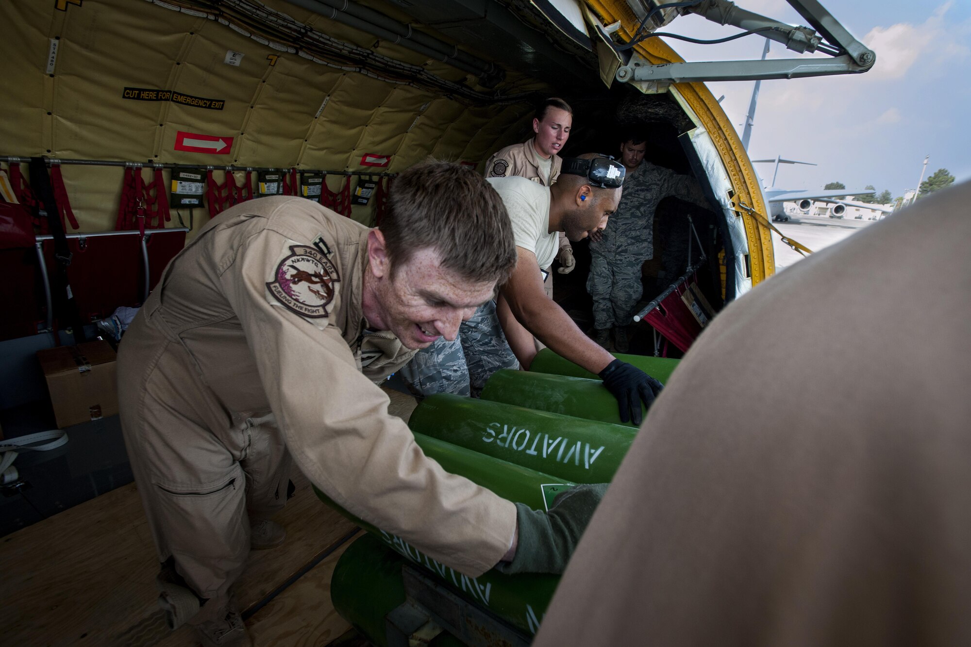 Airmen from the 92nd Air Refueling Squadron, the 22nd Operations Support Squadron and 728th Air Mobility Squadron unload cargo from a KC-135 Stratotanker in support of Operation Inherent Resolve Aug. 10, 2015, at Incirlik Air Base, Turkey. This follows Turkey’s decision to host the deployment of U.S. aircraft conducting counter-ISIL operations. (U.S. Air Force photo by Senior Airman Krystal Ardrey/Released)